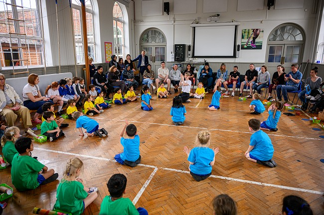 Children performing to their parents as part of the SEED schools project pilot; photograph by David Monteith Hodge, Photographise
