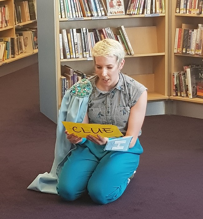 The Book Detectives; photograph by Miriam Levy; performer Megan Griffiths