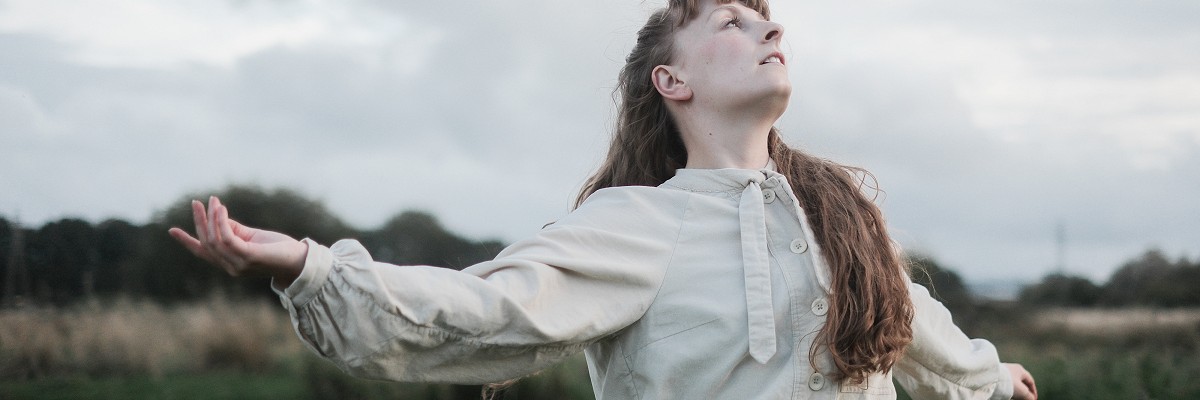 Dancer Alice Shepperson performs next to the ruins of Woking Palace; photographer Matt Walker